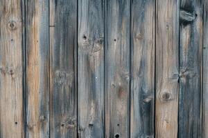 Close-up of a weathered wooden wall with knots and grain patterns photo