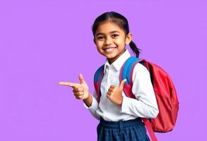 Smiling Schoolgirl in Uniform with Backpack Pointing and Giving Thumbs Up photo