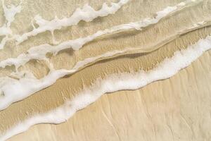 Foamy Wavelets Breaking on a Sandy Beach photo