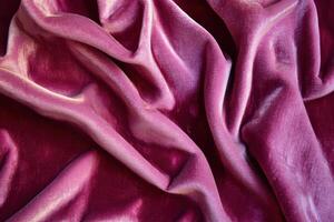 Close-up of Pink Velvet Fabric with Smooth, Draped Folds photo