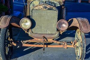 CALIFORNIA, USA - NOVEMBER 26, 2019 - an old badly restored car, decoration in the design photo