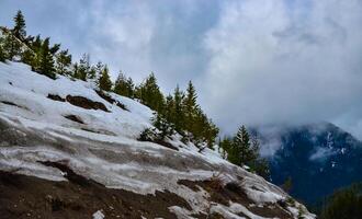Snow in the mountains at the end of winter, snow melting in the mountains. Mountain landscape. photo
