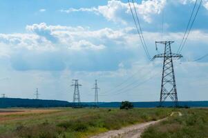 High-voltage power line against the background of the blue sky photo