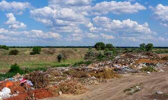 UKRAINE, BOLGRADSKY DISTRICT - JUNE 11, 2011 - Pollution of nature, spontaneous garbage dump in the field, environmental problem of Ukraine photo