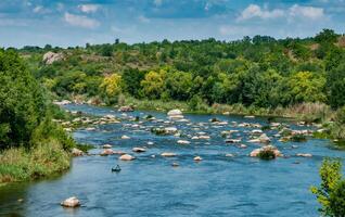 A fisherman in a rubber boat catches fish behind rock rifts in the middle photo
