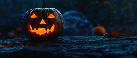Halloween pumpkin with glowing eyes on the ground photo