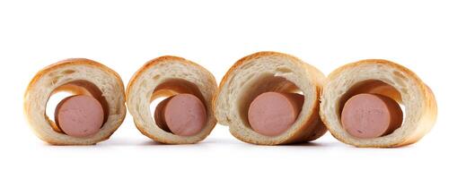 Sausages in dough cut in half isolated on a white background.Sausage in dough. photo