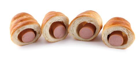 Sausages in dough cut in half isolated on a white background.Sausage in dough. photo