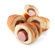 Sausages in dough cut in half isolated on a white background.Sausage in dough. photo