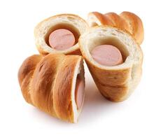 Sausages in dough cut in half isolated on a white background.Sausage in dough. photo