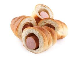 Sausages in dough cut in half isolated on a white background.Sausage in dough. photo