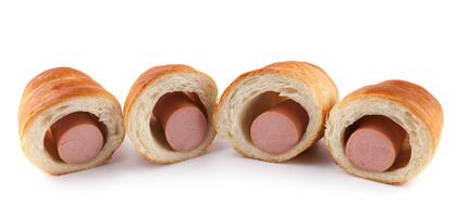 Sausages in dough cut in half isolated on a white background.Sausage in dough. photo