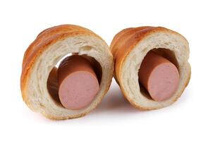 Sausage cut in half in dough isolated on a white background. photo