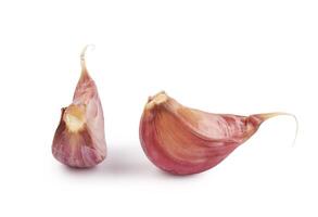 Two cloves of garlic isolated on a white background. Garlic cloves on white. photo
