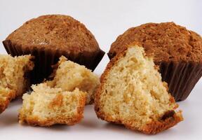 Muffin and muffin pieces on a white background. photo