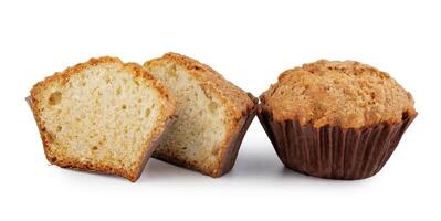 Whole and half muffin isolated on white background. photo