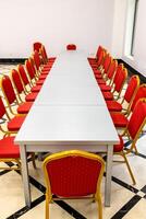 empty long table assembled from gray wooden tables photo