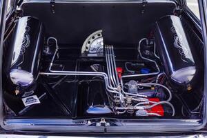15.09.2024. Novosibirsk, Midday, Open car trunk with installation receiver, compressor for pneumatic cylinder. For wall projects, tuning machines, close up photo