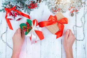 Christmas wooden background with snow branch. Top view with copy space for your text photo