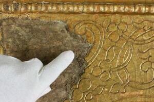 Restoration gold restoration, old icon. close up. conservation of paintings. conservation of sculptures photo