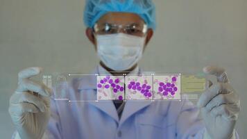 Scientist testing in laboratory.analyze blue DNA sequence. Science background. futuristic technology. data hologram background with space for text video