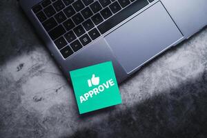 Adhesive note on laptop with approve document and project. Evaluation form. Custommer support. Questionnaire, quiz, approval and acceptance concept. photo