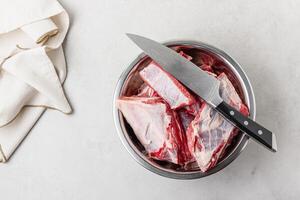 Raw beef ribs in bowl photo