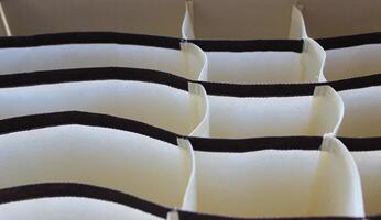 Colorful curved fabric linen drawer compartments photo