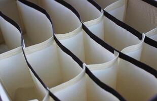 Cells of a colored fabric box for underwear closeup stock photo