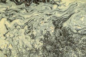 Pollen in a puddle abstract photo