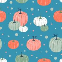 Seamless pattern of colorful pumpkins and spots. on blue background. vector