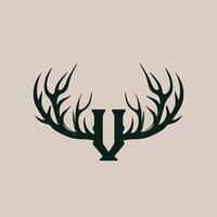 The letter v is shown in a deer head vector