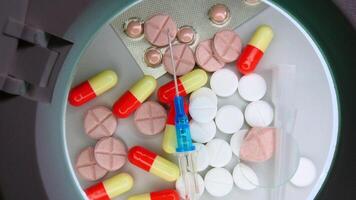 A round object with pills and pills inside video