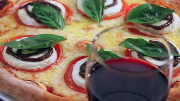 A pizza with cheese, tomatoes and basil video