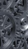 A close-up perspective showcases a series of rotating interlocking metal gears, highlighting the precise engineering and the complexity of mechanical design in machinery. vertical footage video