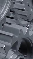 A close-up perspective showcases a series of rotating interlocking metal gears, highlighting the precise engineering and the complexity of mechanical design in machinery. vertical footage video