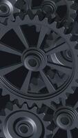 A close-up perspective showcases a series of rotating interlocking metal gears, highlighting the precise engineering and the complexity of mechanical design in machinery. vertical footage video