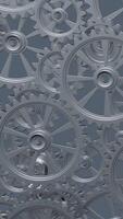A close-up perspective showcases a series of rotating interlocking metal gears, highlighting the precise engineering and the complexity of mechanical design in machinery. vertical footage video