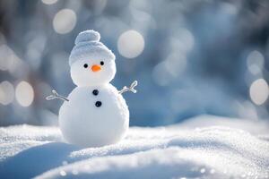 Little snowman standing on a snowy landscape photo
