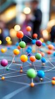 Colorful pins creating a network on top of a reflective surface photo