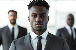 Serious businessman leading his team in the office photo