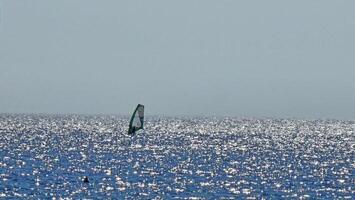 coastal landscapes with the beach and the sparkle of the sea during summer days photo