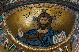 in the Cathedral of Cefalu dominates the Pantocrator. Face of Christ who is transfigured before Peter, James and John. Face that proclaims itself the light of the world. photo