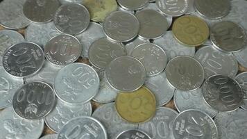 stack of Indonesian coins on rotating display video
