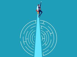 man standing on top of a maze with a light at the end vector