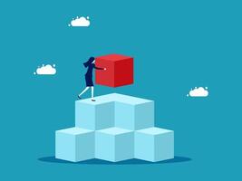 businesswoman standing on top of cube blocks with red cube vector