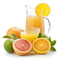 citrus juice in a jug and glass and citruses photo