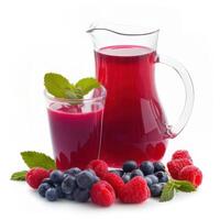 berry juice in a jug and glass and berries photo