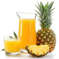 pineapple juice in a jug and glass and pineapples photo