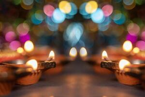 Glowing clay lanterns during Indian festival Diwali celebrations with bokeh effect background with copy space. photo